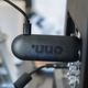 A photo of the Onn FHD Streaming Stick plugged into the back of the TV with wires everywhere around it